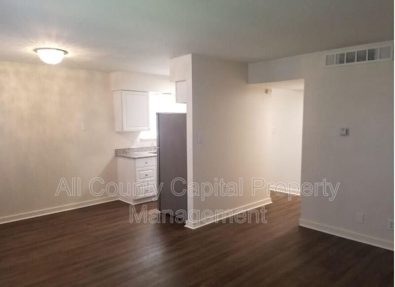 3415 Willowrun Drive, Unit C Austin, TX 78704 - Photo 3 of 9 a view of empty room with wooden floor