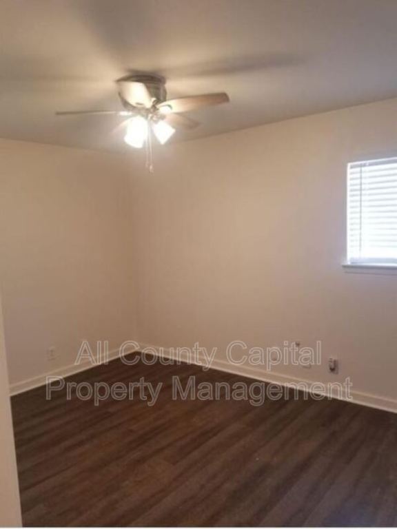 3415 Willowrun Drive, Unit C Austin, TX 78704 - Photo 7 of 9 a view of an empty room with wooden floor