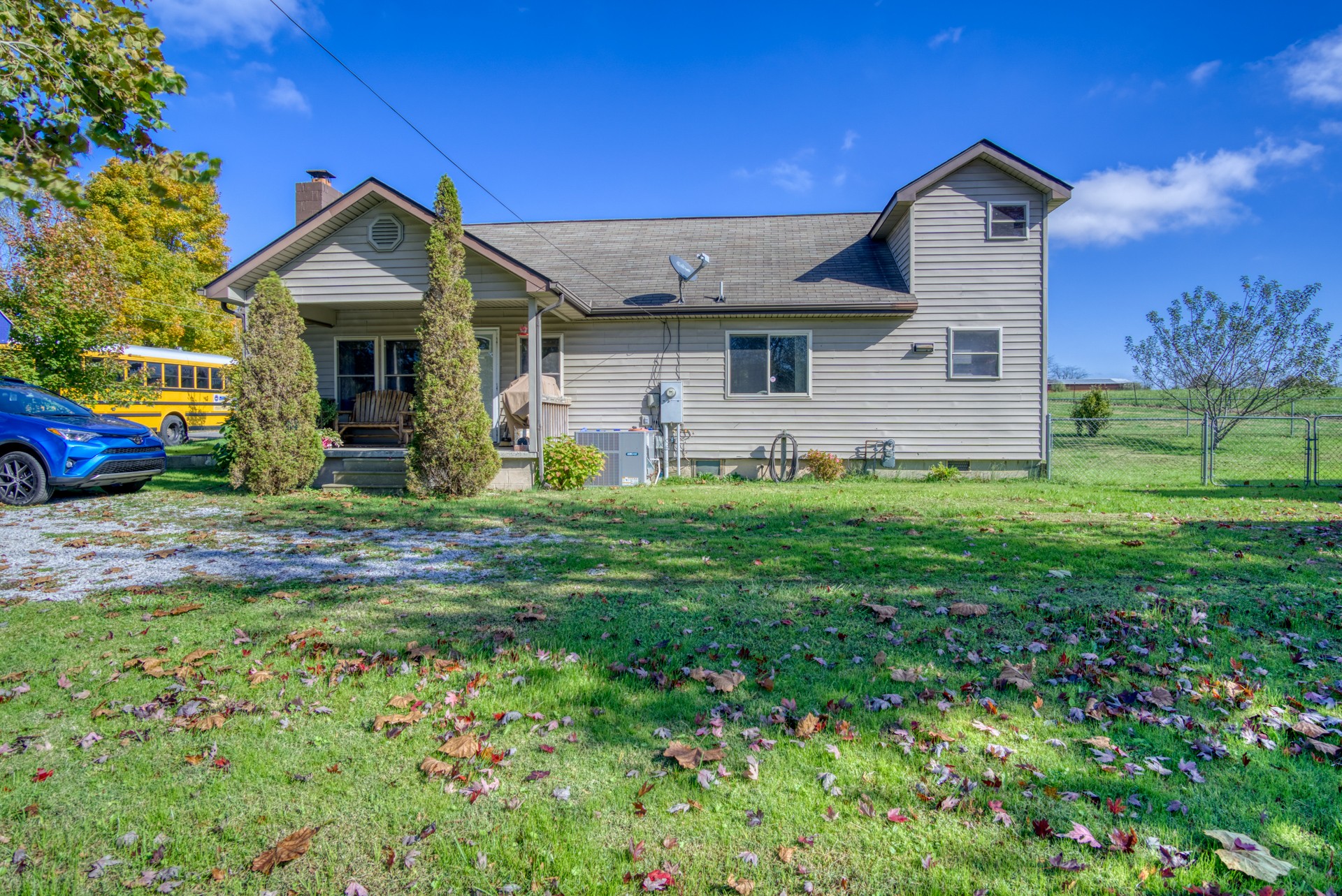 738 Pugh Road Crossville, TN 38555 - Photo 1 of 26 a front view of a house with a yard and garage