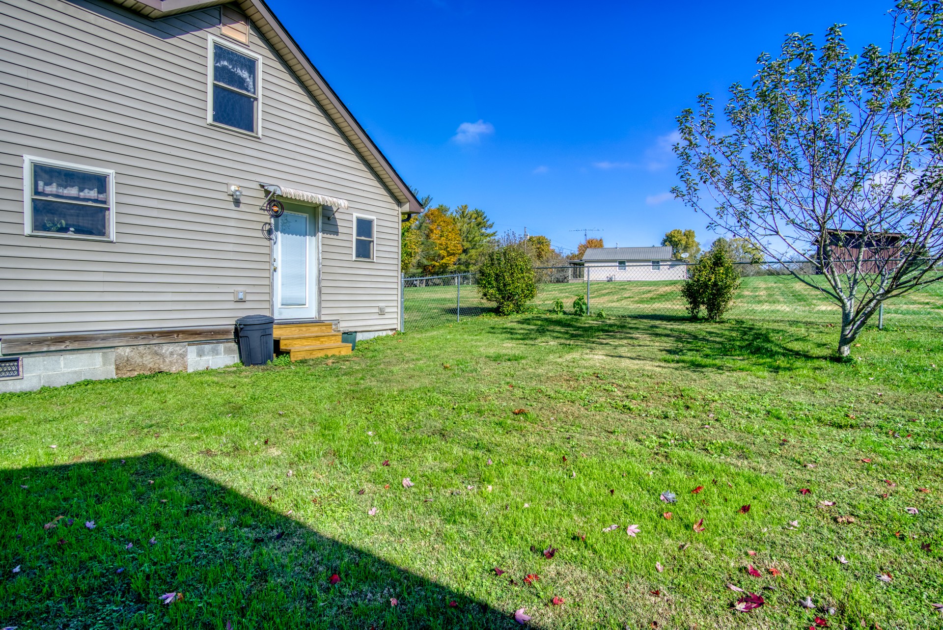 738 Pugh Road Crossville, TN 38555 - Photo 13 of 26 a view of a house with a backyard