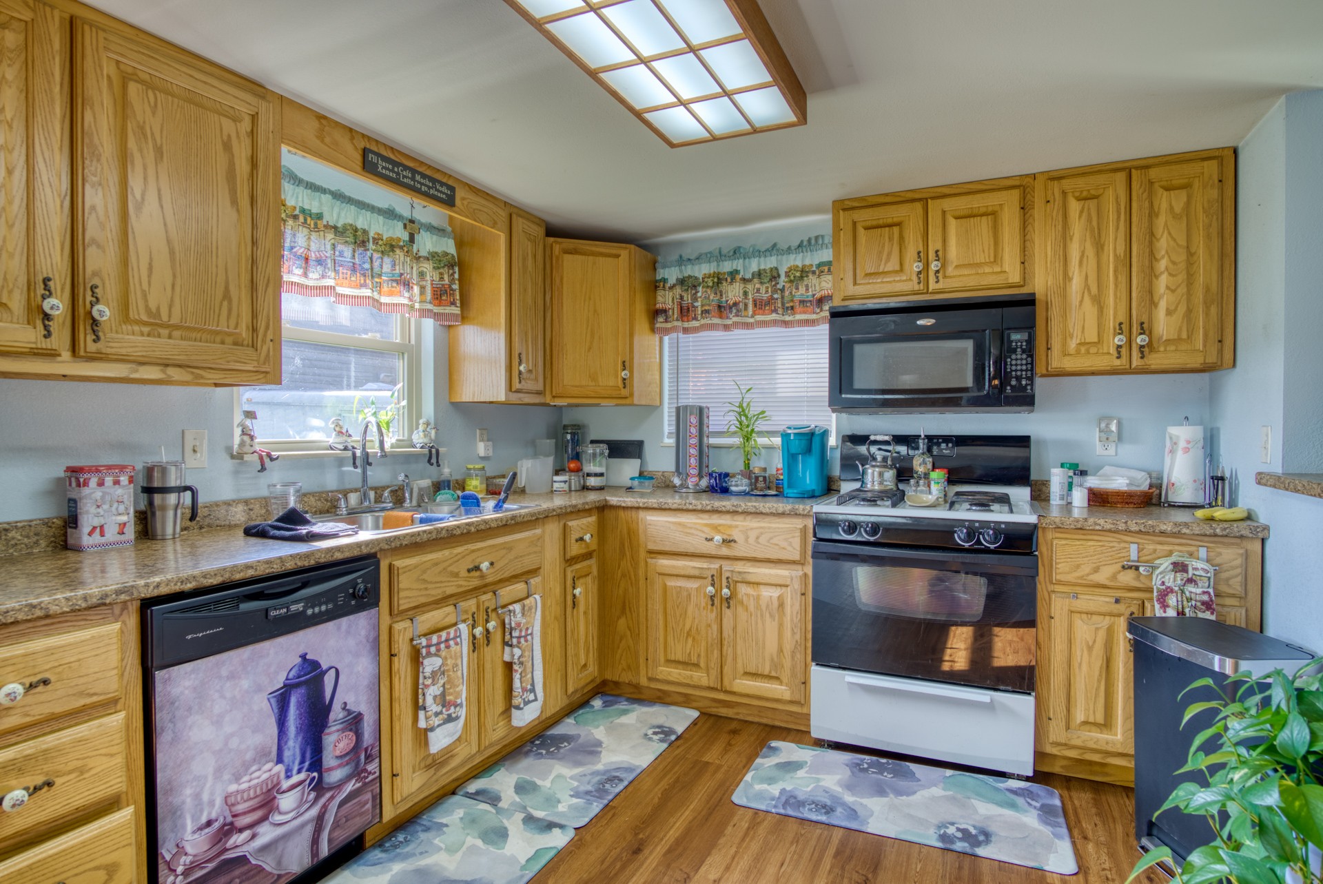 738 Pugh Road Crossville, TN 38555 - Photo 19 of 26 a kitchen with stainless steel appliances granite countertop a stove a sink dishwasher and a microwave oven with cabinets