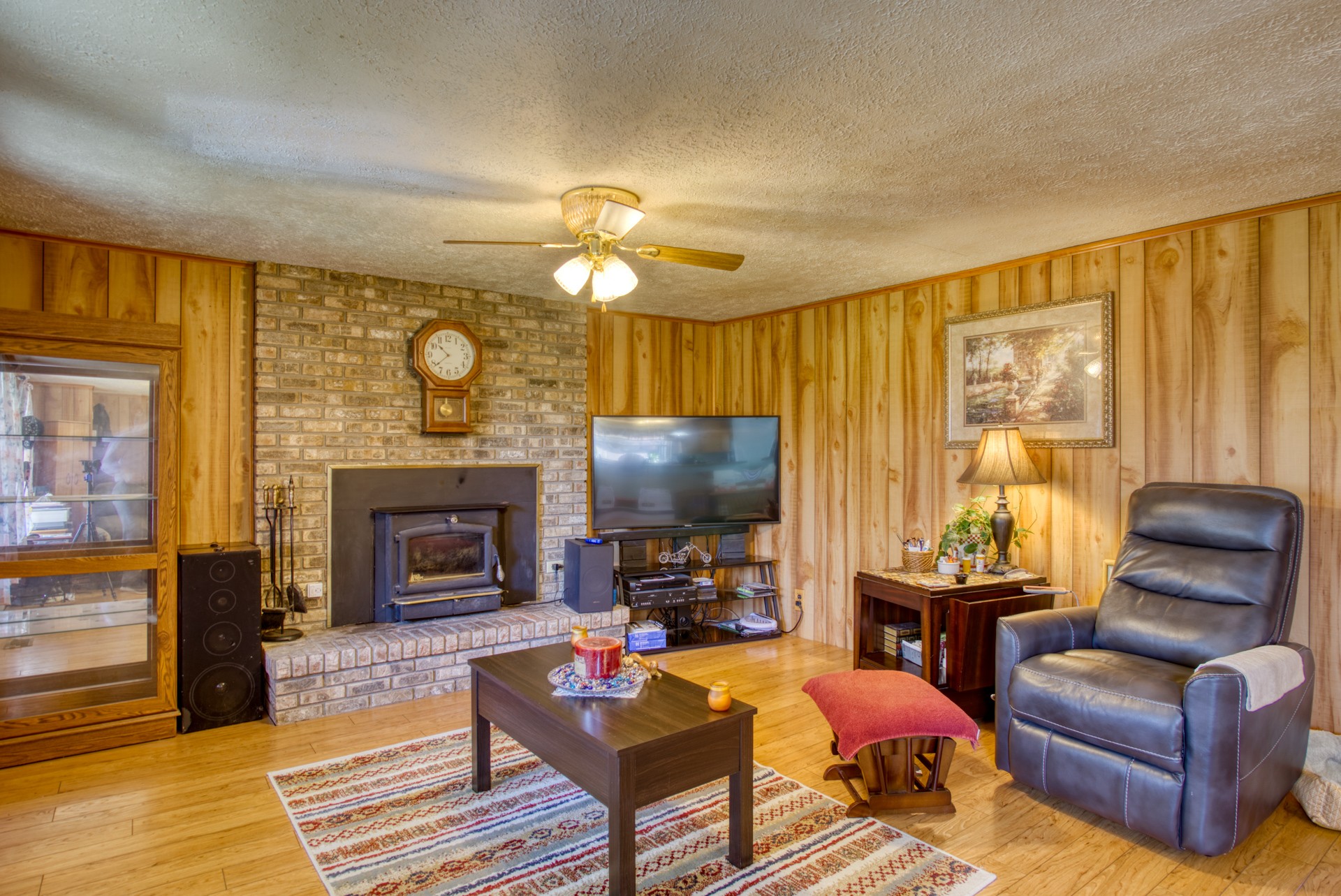 738 Pugh Road Crossville, TN 38555 - Photo 3 of 26 a living room with furniture a fireplace and a flat screen tv