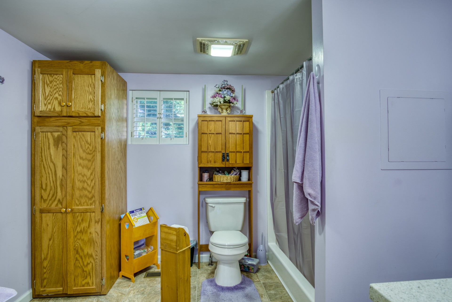 738 Pugh Road Crossville, TN 38555 - Photo 24 of 26 a bathroom with a granite countertop toilet and a shower