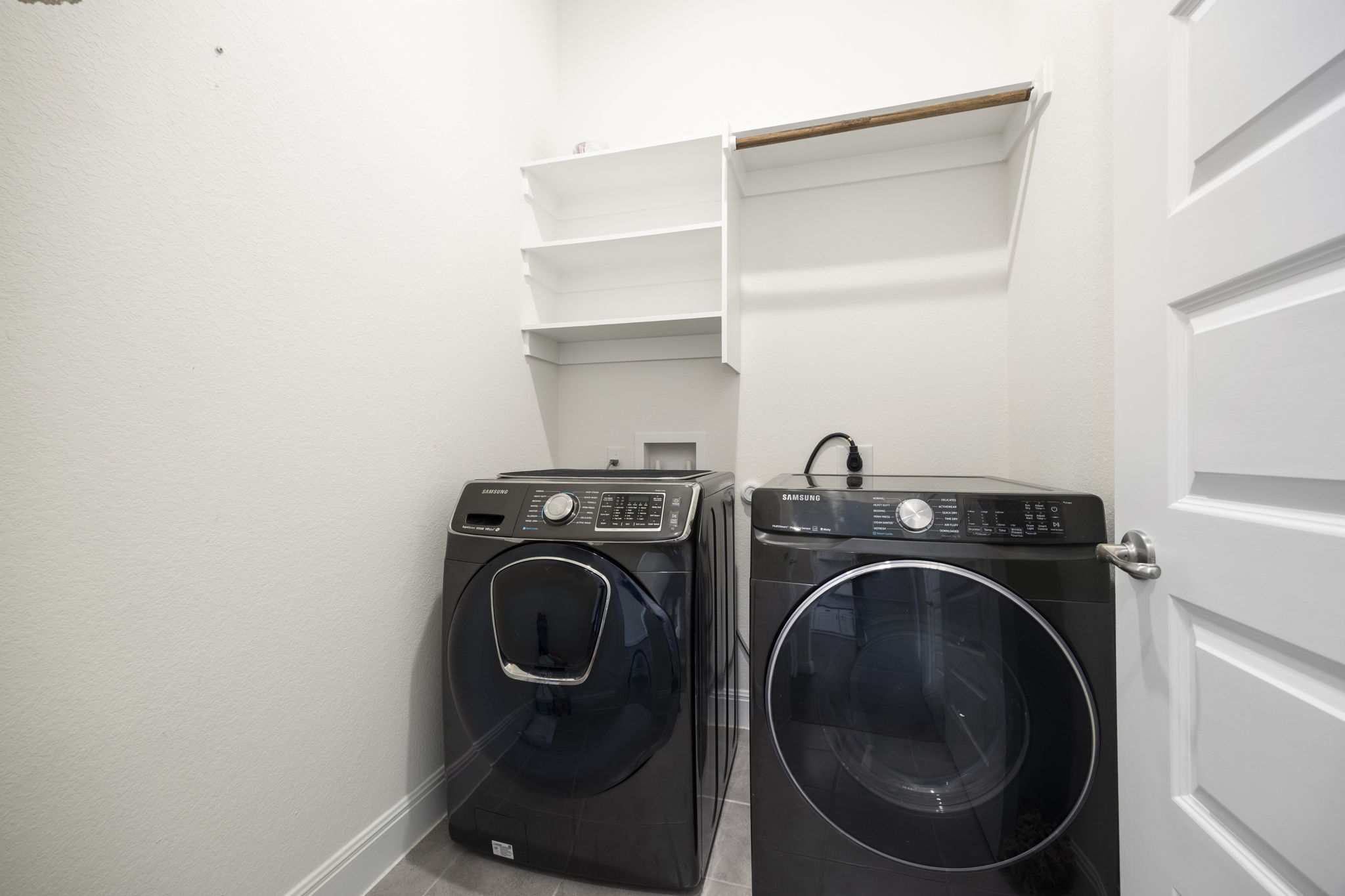 1098 Cherrystone Loop Buda, TX 78610 - Photo 31 of 37 a utility room with dryer and washer