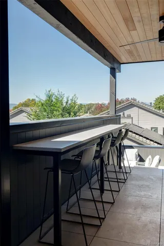 a view of dinning table and chairs in patio