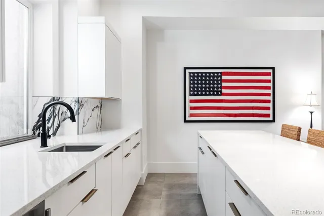 a kitchen with a sink and a kitchen island