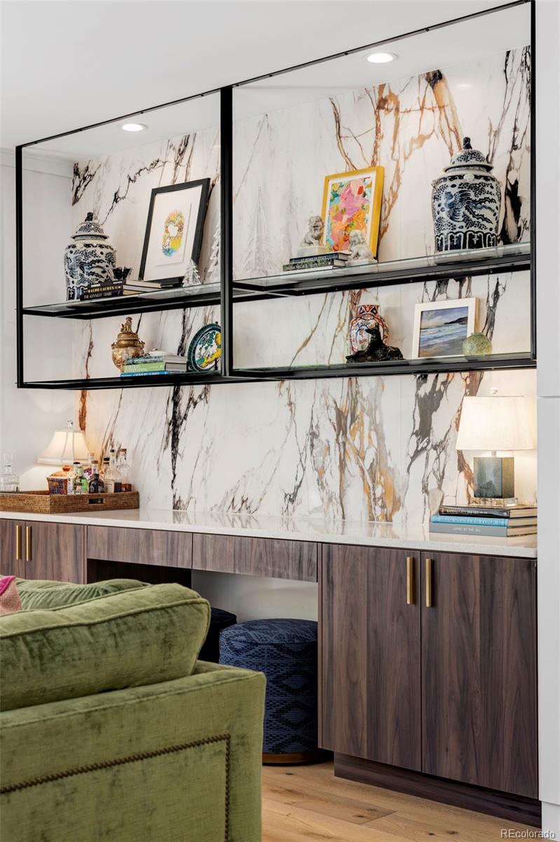 255 Jackson Street Denver, CO 80206 - Photo 8 of 32 a living room with a couch and painting on the wall