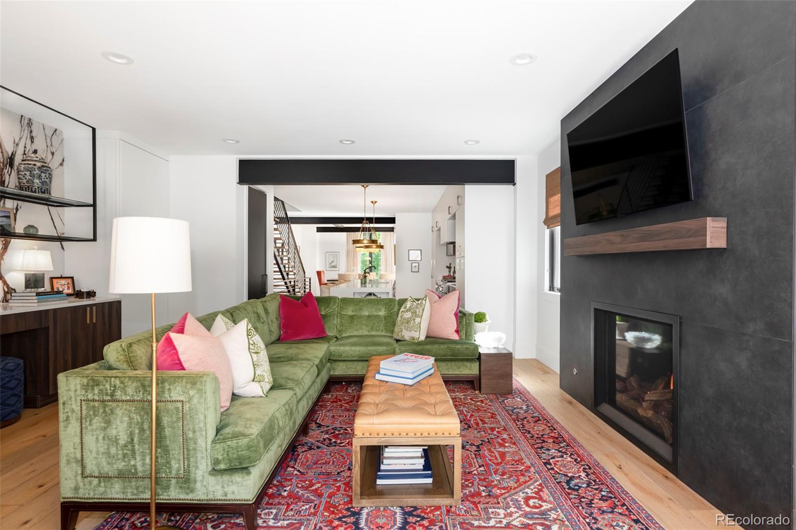 255 Jackson Street Denver, CO 80206 - Photo 10 of 32 a living room with furniture and a fireplace