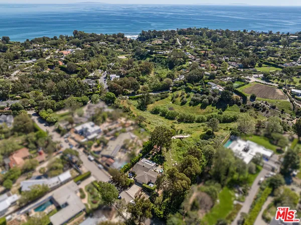 an aerial view of a house and a yard