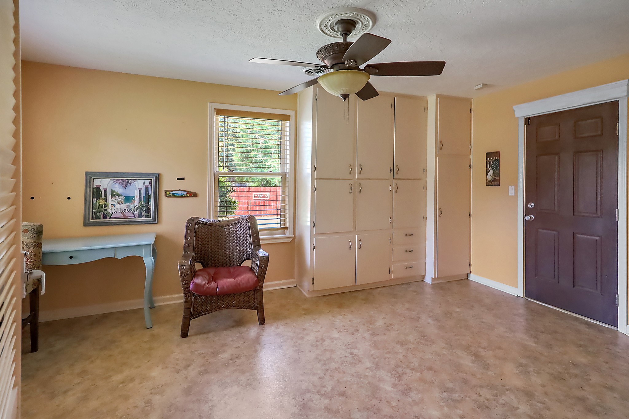 405 Park Street Anahuac, TX 77514 - Photo 17 of 37 The mud room has an exterior rear door and built ins.