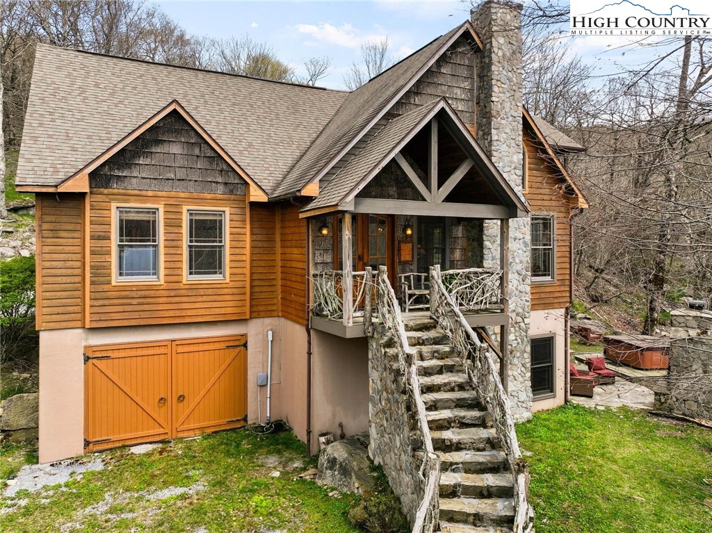 140 Spruce Hollow Road Beech Mountain, NC 28604 - Photo 6 of 50 a front view of a house with a yard