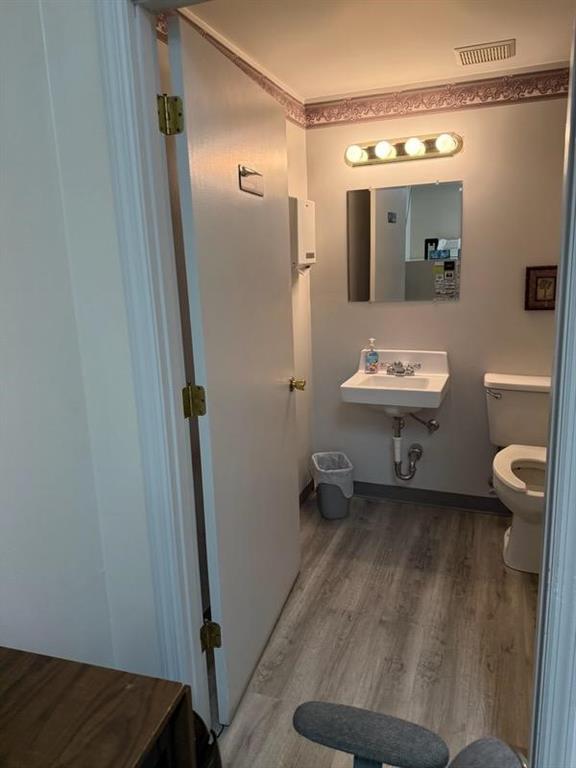 2884 East Hardies Road Gibsonia, PA 15044 - Photo 5 of 8 a bathroom with a sink a toilet and mirror