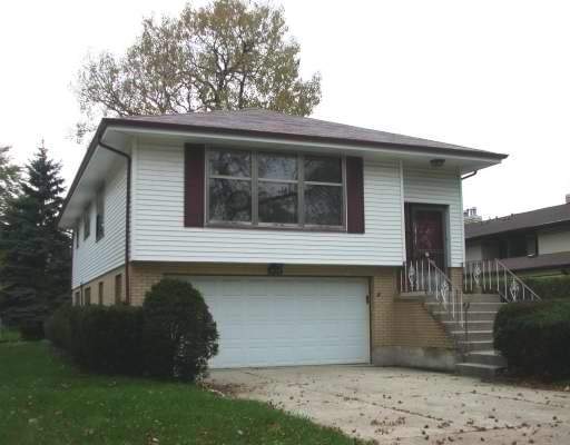 408 Blackhawk Road Riverside, IL 60546 - Photo 1 of 1 a front view of a house with a garden