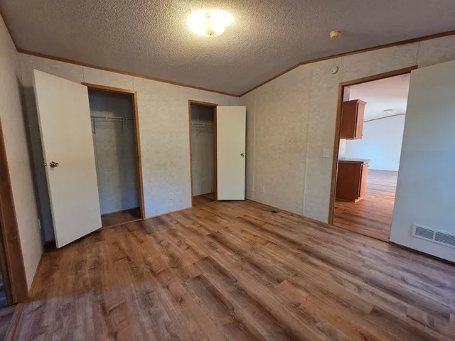 a view of a livingroom with wooden floor