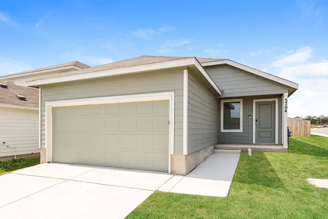 a view of house with backyard