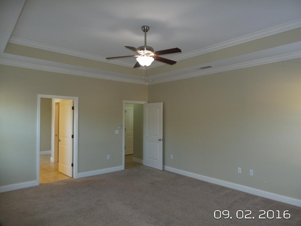 4589 Hermosa Road Crestview, FL 32539 - Photo 14 of 21 an empty room with closet and a chandelier fan