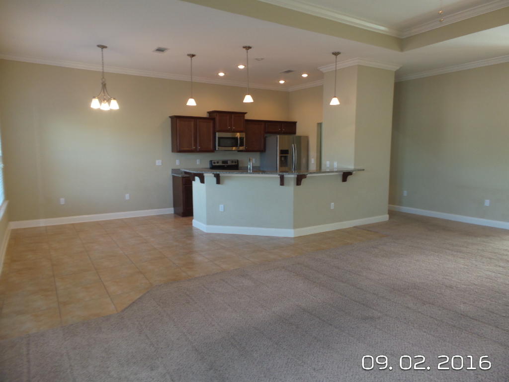 4589 Hermosa Road Crestview, FL 32539 - Photo 5 of 21 a view of a kitchen with a sink and a microwave