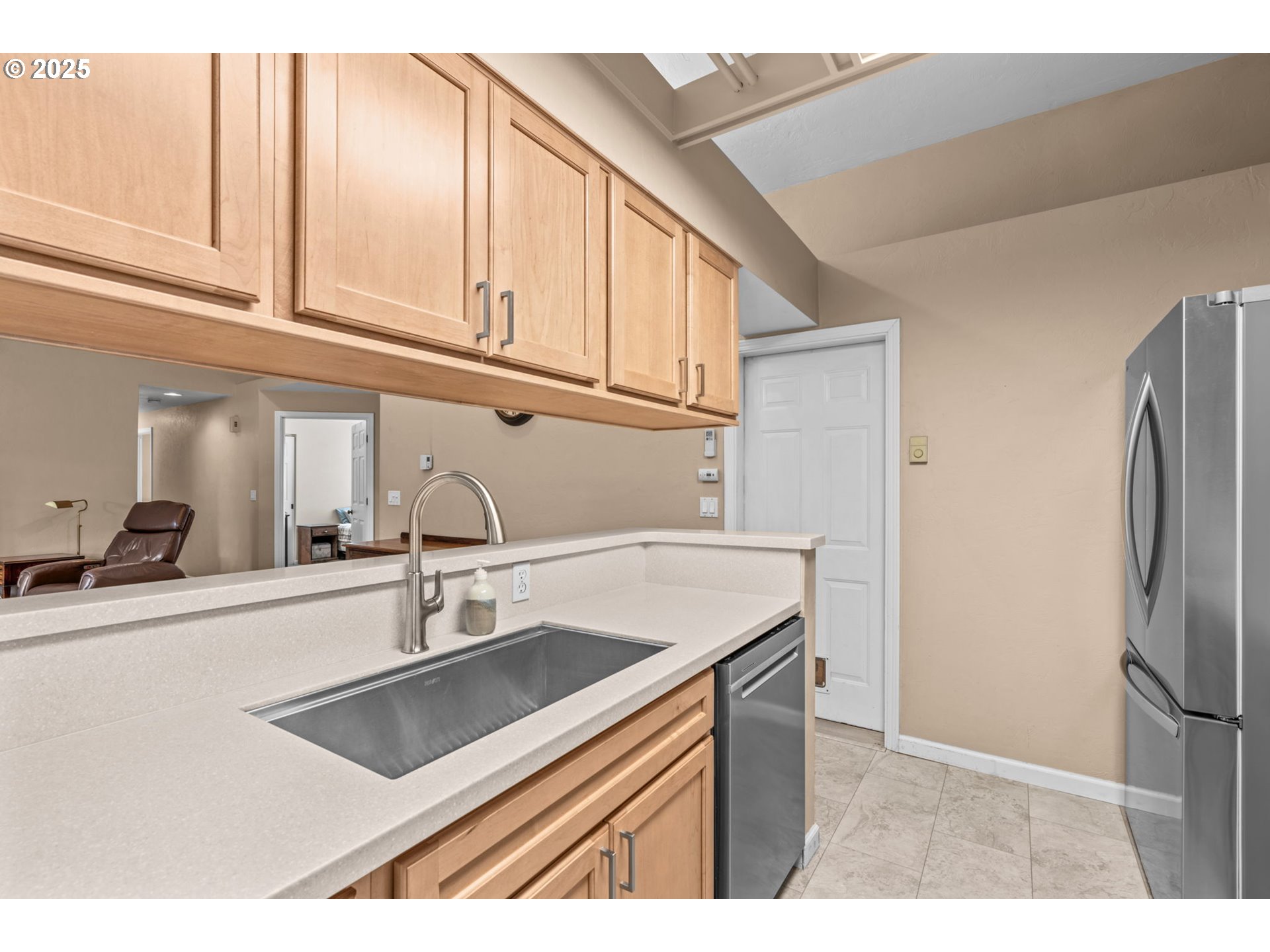 2180 Southeast Madison Street Albany, OR 97322 - Photo 13 of 28 a kitchen with stainless steel appliances granite countertop a sink and a refrigerator