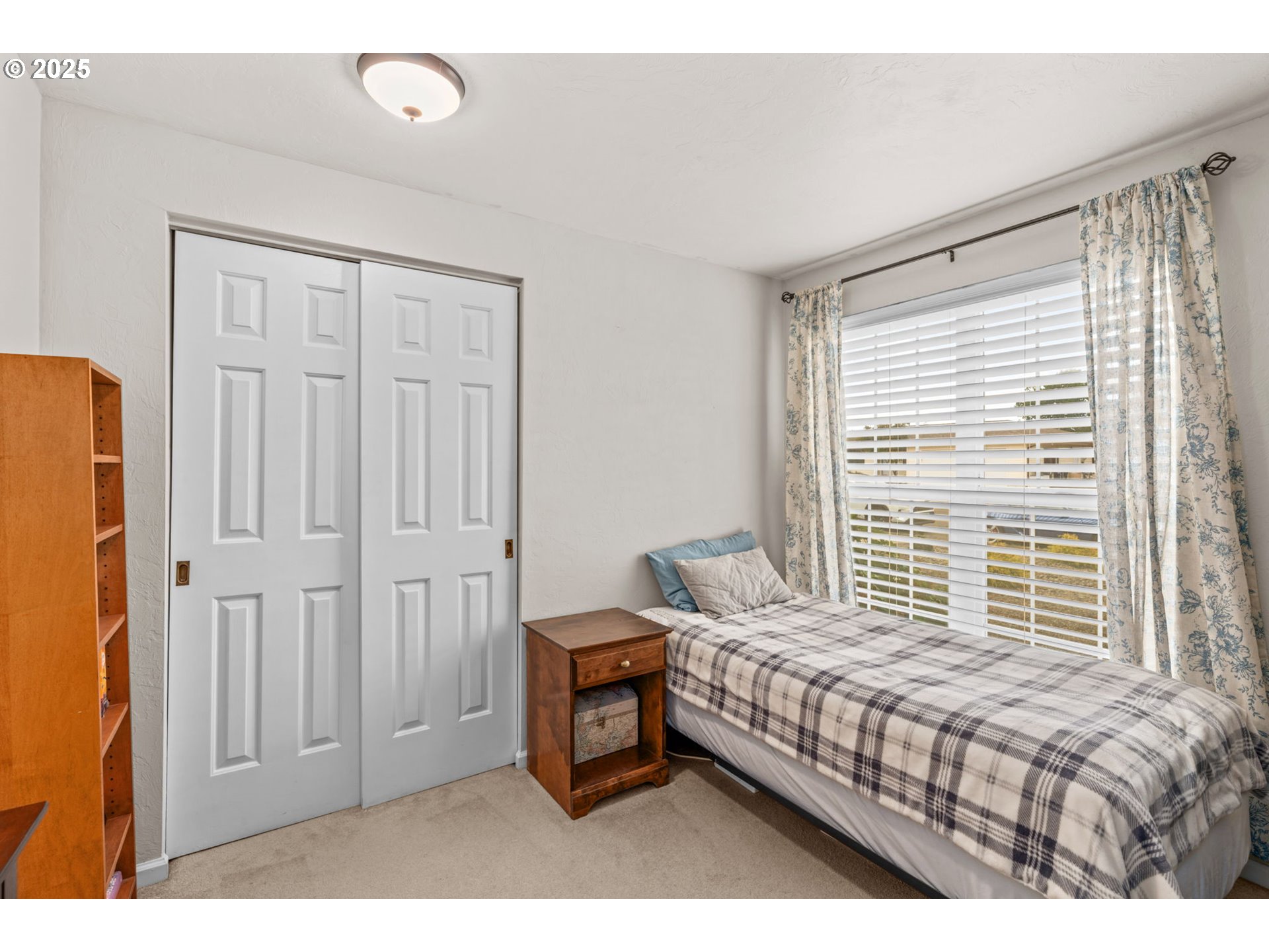 2180 Southeast Madison Street Albany, OR 97322 - Photo 14 of 28 a bedroom with a bed and a window