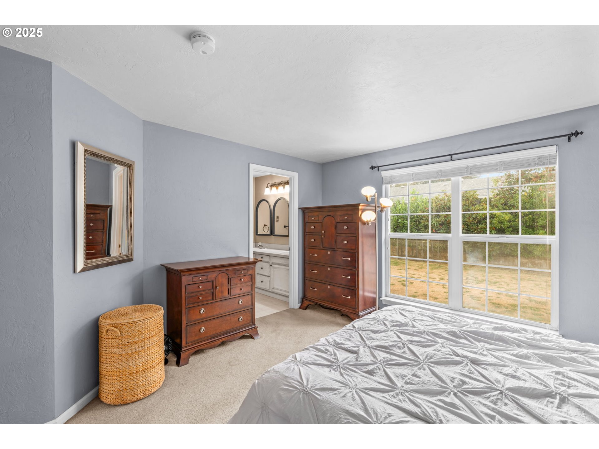 2180 Southeast Madison Street Albany, OR 97322 - Photo 17 of 28 a bedroom with a bed and window