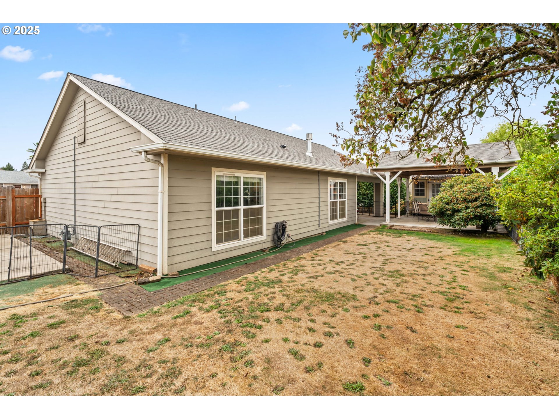 2180 Southeast Madison Street Albany, OR 97322 - Photo 26 of 28 a view of a house with a backyard