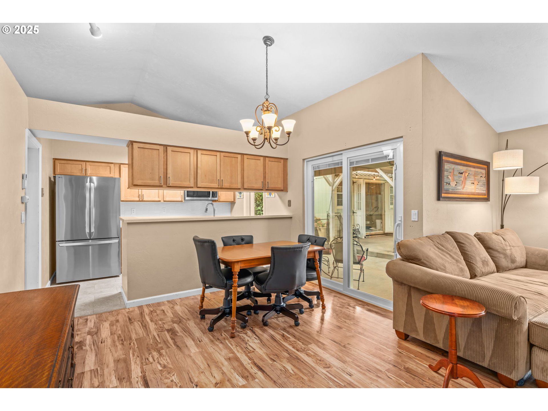 2180 Southeast Madison Street Albany, OR 97322 - Photo 8 of 28 a living room with furniture and a chandelier
