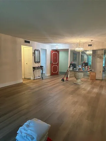 a bedroom with furniture and a mirror