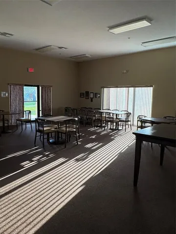 a living room with lots of furniture and a wooden floor