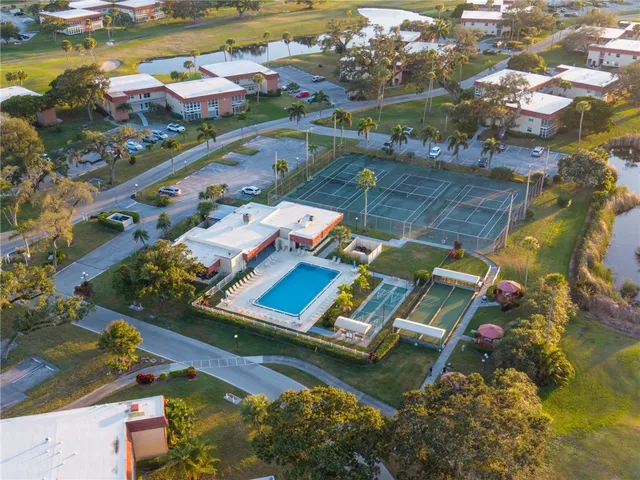 an aerial view of a house with a ocean view