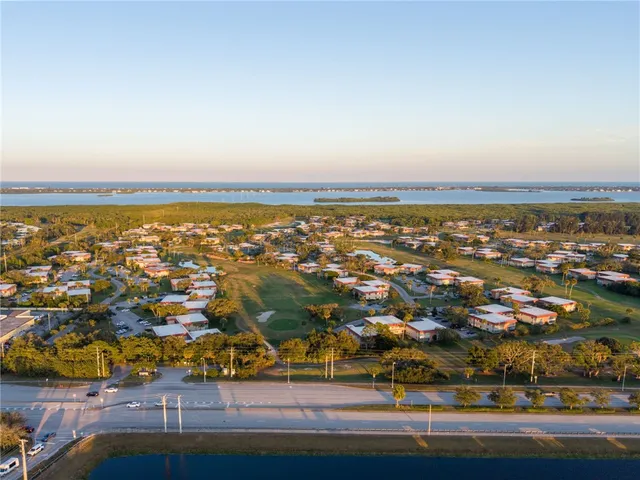 an aerial view of residential building and ocean