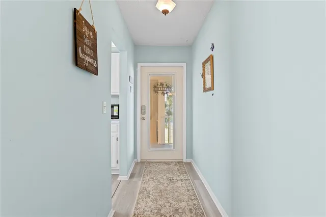 a view of a hallway with front door