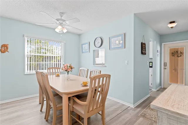a dining room with furniture and window