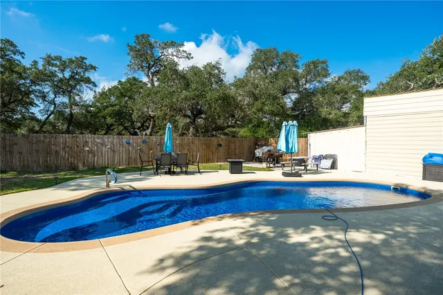 a view of swimming pool and lounge chair