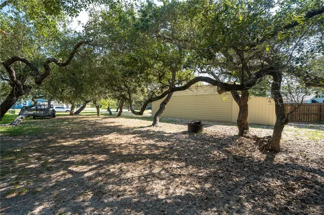 a backyard of a house with lots of green space