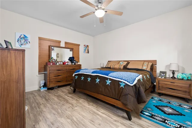 a bedroom with a bed and window