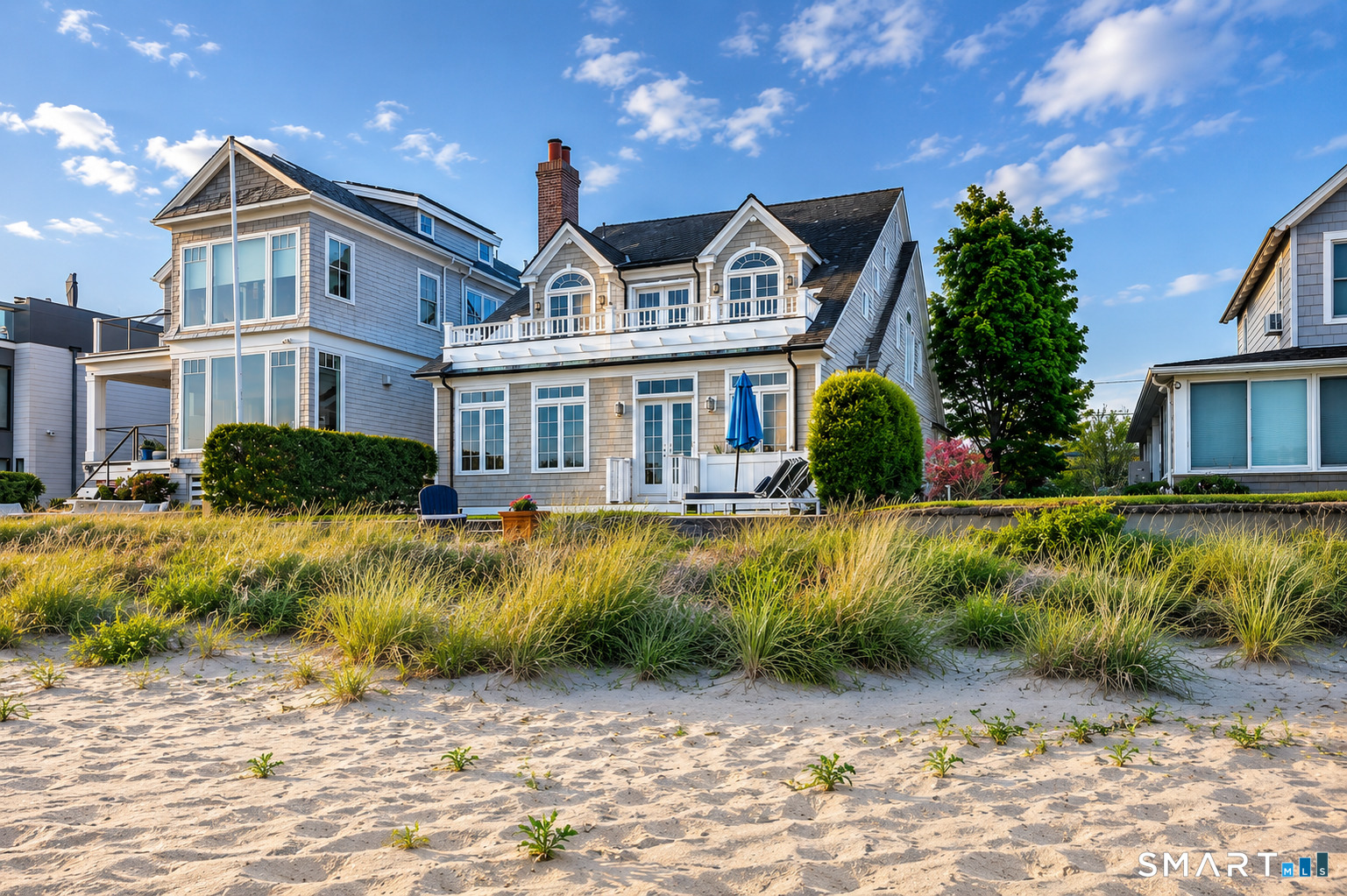 1681 Fairfield Beach Road Fairfield, CT 06824 - Photo 35 of 36 Viewed from the beach, the home's thoughtful siting becomes clear-set behind established dunes and beach grass, with a comfortable relationship between house, shoreline, and sea.