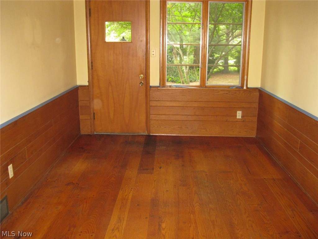 3550 Marsh Road Stow, OH 44224 - Photo 13 of 35 This view of family room shows an outside entry and wood floors.