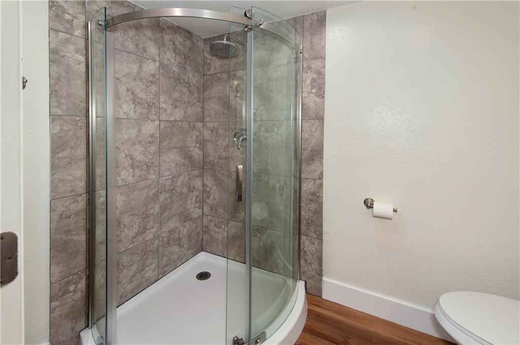 396 Cove Boulevard, Unit 12 Dillon, CO 80435 - Photo 14 of 20 a bathroom with a bathtub and a shower