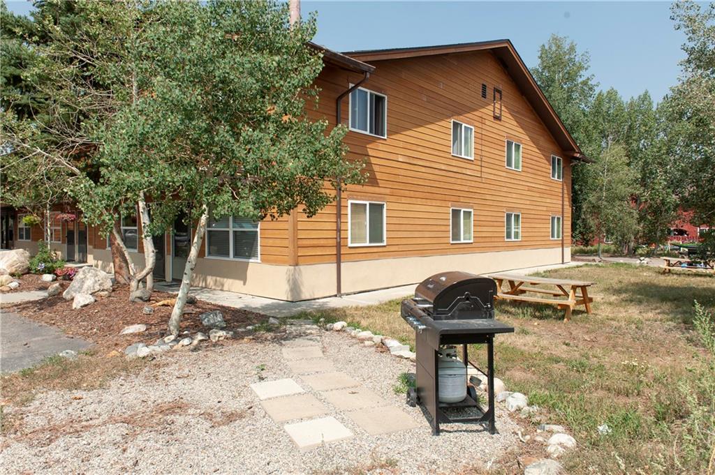 396 Cove Boulevard, Unit 12 Dillon, CO 80435 - Photo 16 of 20 a backyard of a house with yard and outdoor seating