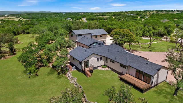an aerial view of a house with a garden