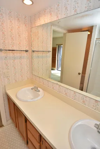 a bathroom with a sink and a mirror