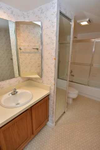 a view of a brick house with a large windows