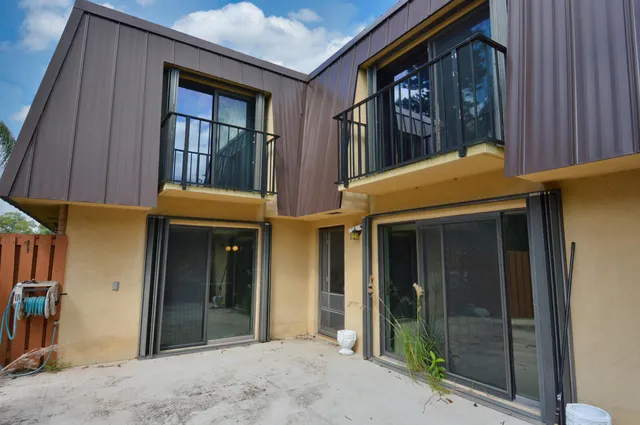 a view of a garden and deck