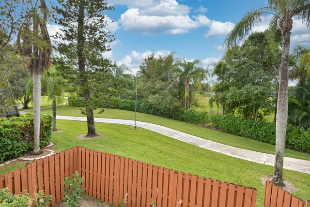 a view of a patio with a yard