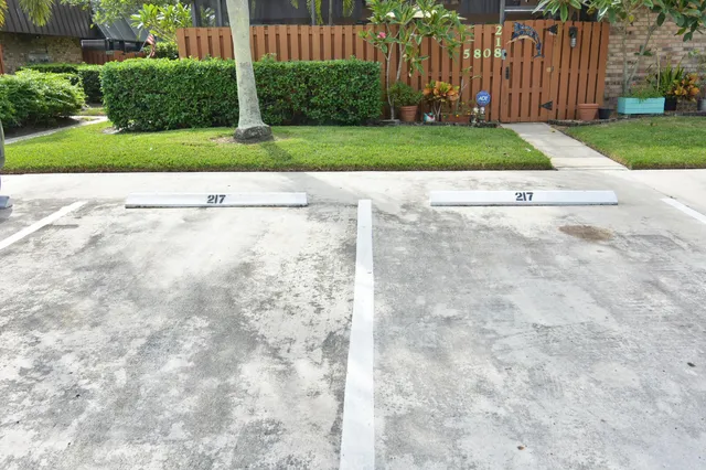 a view of a lake with houses in the back