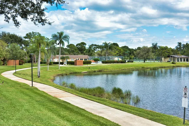 a view of a yard with a table and chairs