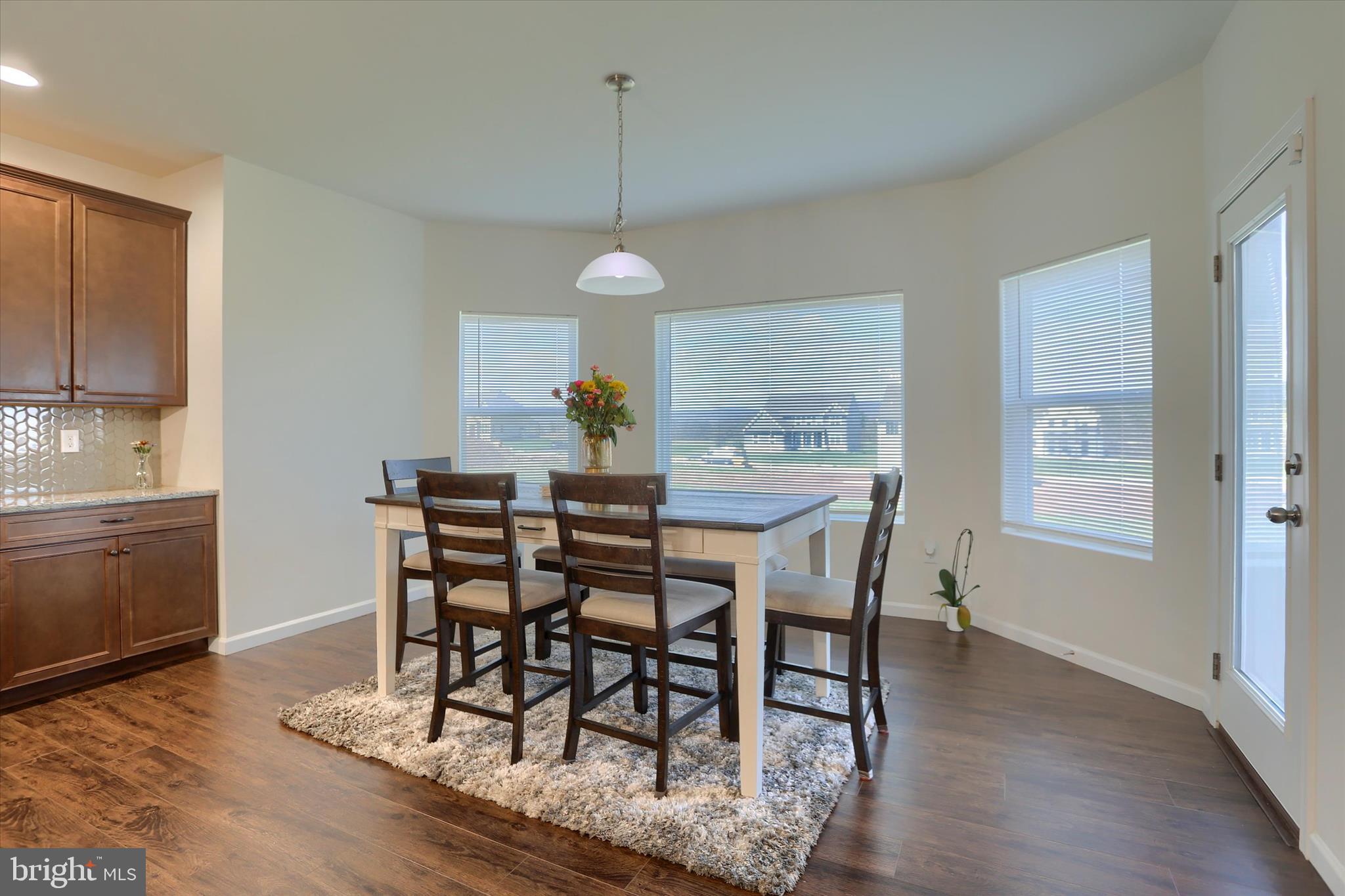 515 Darrow Road York, PA 17404 - Photo 15 of 41 a view of a dining room with furniture window and wooden floor