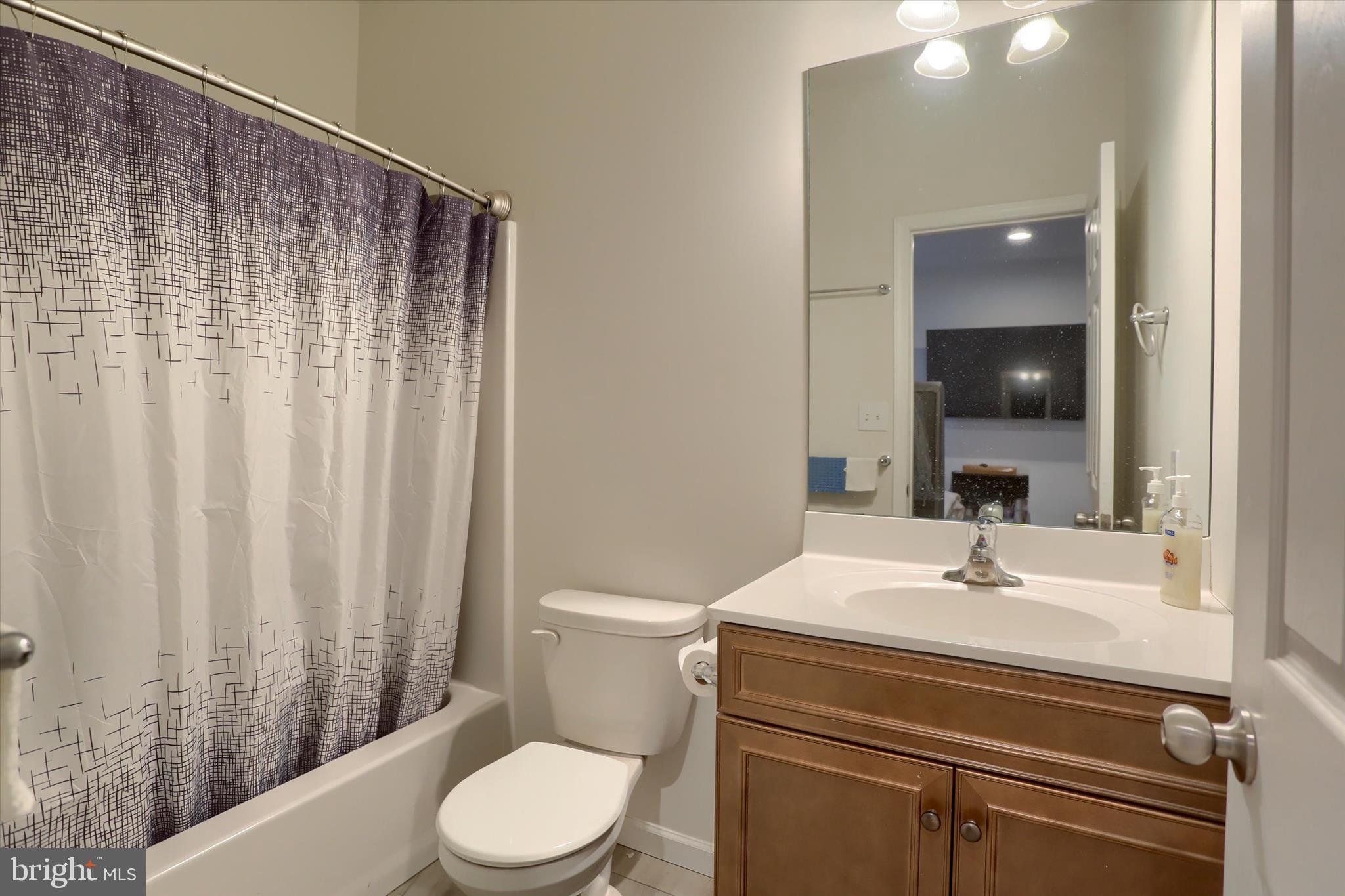 515 Darrow Road York, PA 17404 - Photo 20 of 41 a bathroom with a sink a toilet and shower curtain