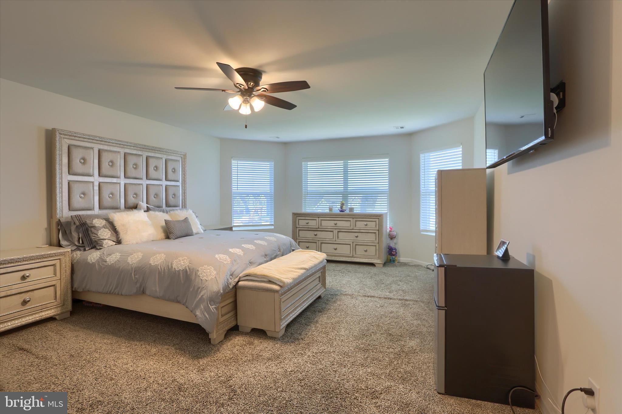 515 Darrow Road York, PA 17404 - Photo 25 of 41 a bedroom with a bed and a flat tv screen on dresser