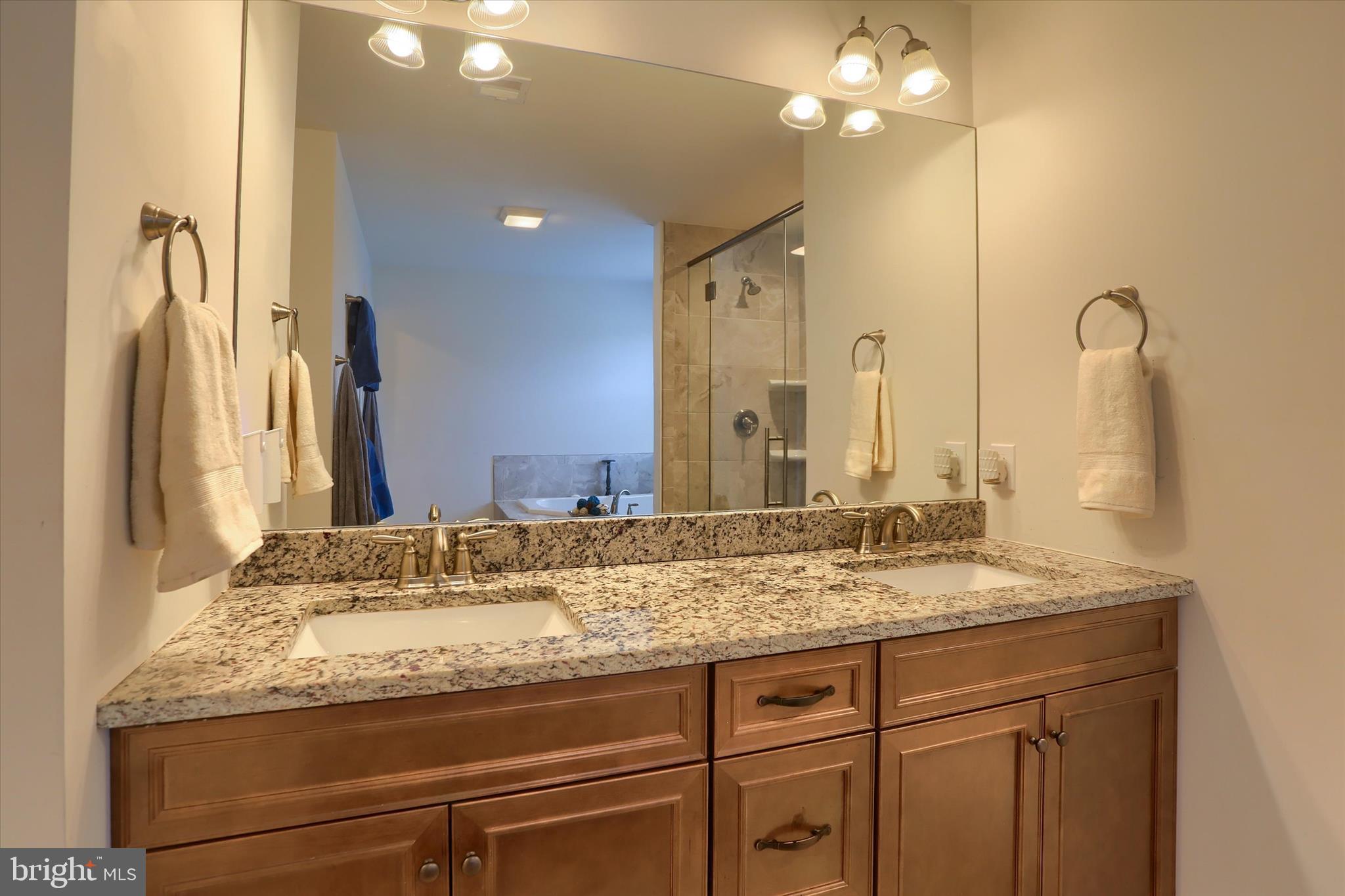 515 Darrow Road York, PA 17404 - Photo 28 of 41 a bathroom with a granite countertop sink and a mirror